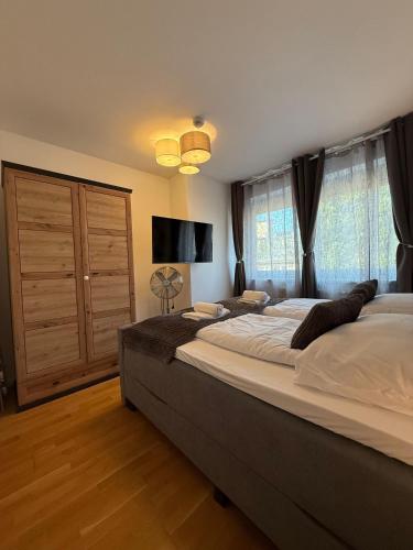 Ένα ή περισσότερα κρεβάτια σε δωμάτιο στο Stylish 1BR Apartment near Favoritenstrasse Central and Cozy