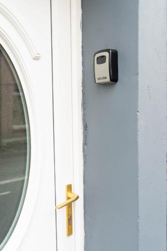 a door with a toaster on it next to a window at Victoria Retreat in Workington