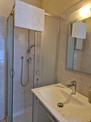 a bathroom with a sink and a shower at Antica Corte in Lucca