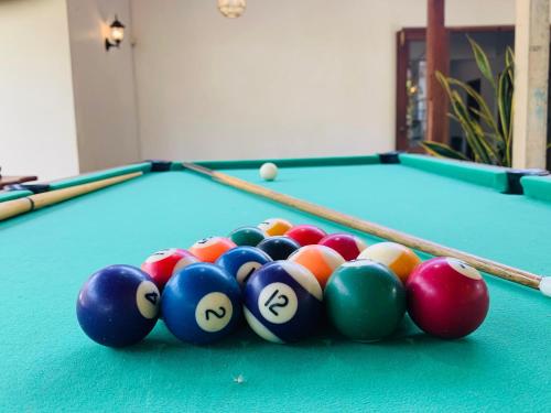 a group of billiard balls on a pool table at Dhona's Villa in Sigiriya
