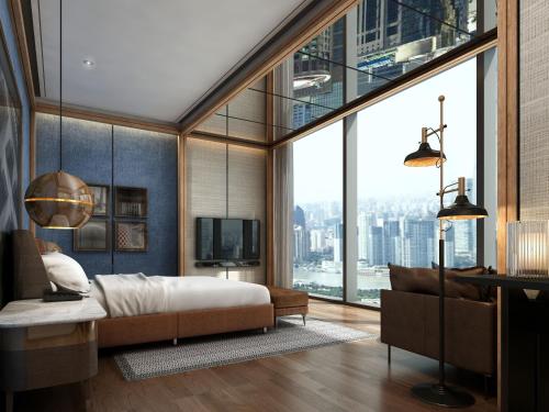 a bedroom with a bed and a large window at Thompson Shanghai Expo in Shanghai