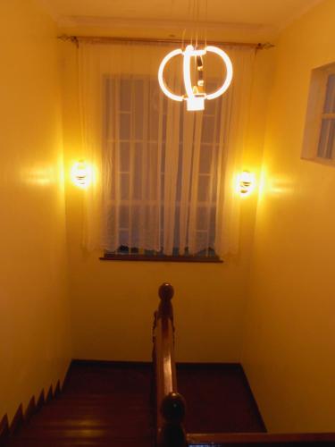 a room with two lights on the wall and a window at The Nook at Axis Garden Suites, Solo Ensuite Near JKIA,SGR,Nairobi express way with Workspace in Syokimau