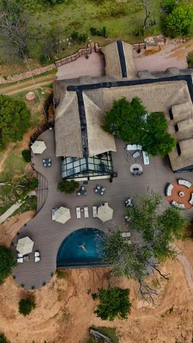 an aerial view of a parking lot with a pool at Honeyguide Conservation Lodge in Golders Green