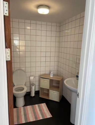 a bathroom with a toilet and a sink at 34 - Room 1 - Uplands in Swansea