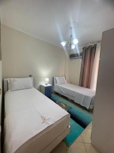 Krevet ili kreveti u jedinici u okviru objekta Arbër apartment
