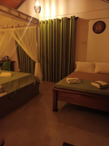 Ένα ή περισσότερα κρεβάτια σε δωμάτιο στο Sunshine Forest Lodge - Sinharaja