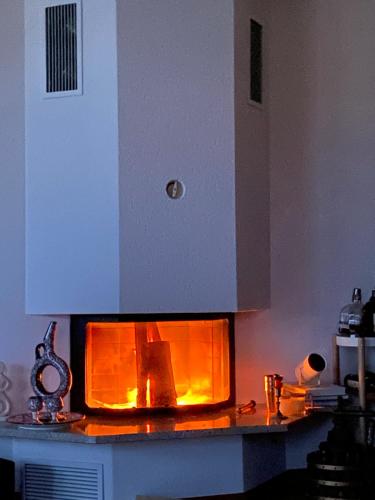 a kitchen with a fire in the oven at Your home away from home in Zug in Zug
