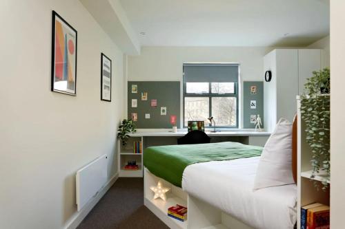 a small bedroom with a bed and a window at For Students Only - Snow Island in Huddersfield in Huddersfield