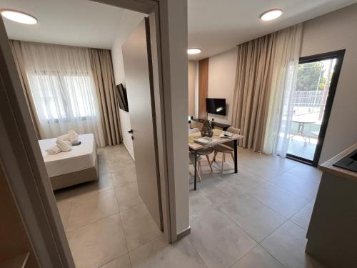 a living room with a couch and a table at Ensueno Apartments Keramoti in Keramotí
