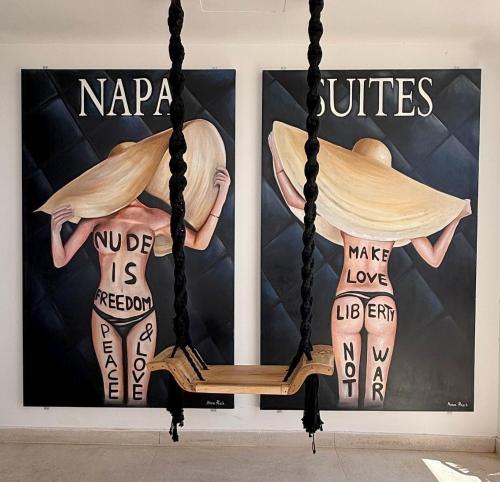 a swing in front of two posters of women at Hotel Napa Suites (Adults Only) in Ayia Napa