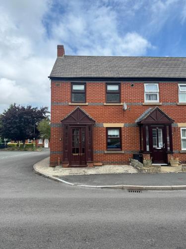 a red brick house on the side of a street at 2 bed house, walking distance Shrewsbury centre in Shrewsbury