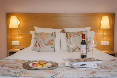 Ένα ή περισσότερα κρεβάτια σε δωμάτιο στο Grand Hotel Dore