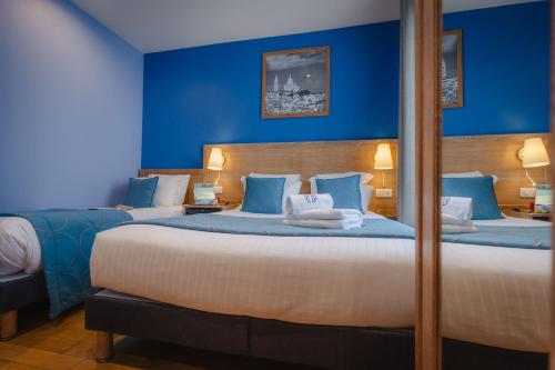 Ένα ή περισσότερα κρεβάτια σε δωμάτιο στο Grand Hotel Dore