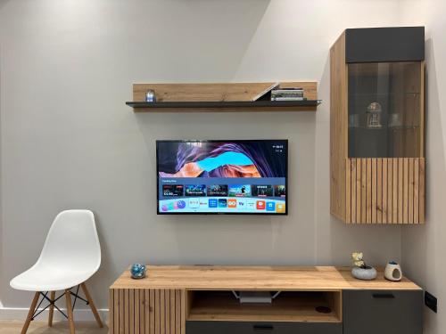 Télévision ou salle de divertissement dans l'établissement glenz apartments