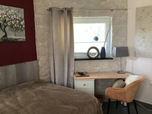 Ένα ή περισσότερα κρεβάτια σε δωμάτιο στο Ambiente Wohnen im Garten
