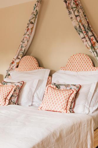 a bedroom with two beds with pillows at Zámecká Stodola - Červený Hrádek u Sedlčan in Sedlčany