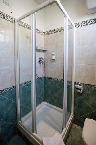 a shower with a glass door in a bathroom at Bellavista Impruneta in Impruneta