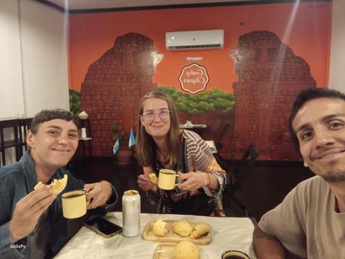 a group of people sitting at a table with drinks at Curiango Bird Camp in Puerto Iguazú