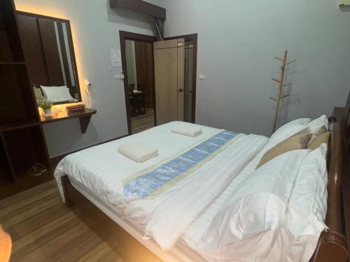 a bed with two towels on it in a room at Private 2 Bedroom Pool Villa in Ao Nang with Stunning Views in Ao Nang 