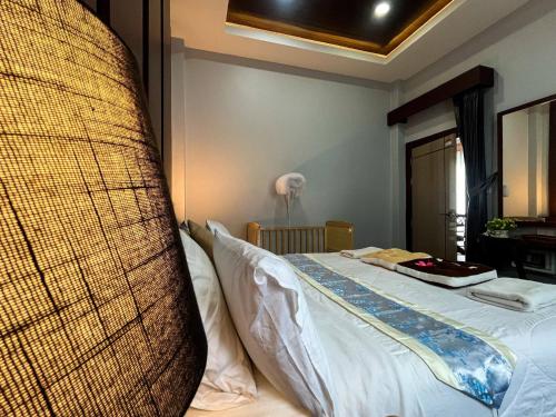 a bedroom with a bed with a large pillow at Private 2 Bedroom Pool Villa in Ao Nang with Stunning Views in Ao Nang 