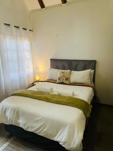 Katil atau katil-katil dalam bilik di Pecan Bush Lodge