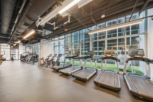 a gym with rows of treadmills and ellipticals at Sentral Michigan Avenue in Chicago