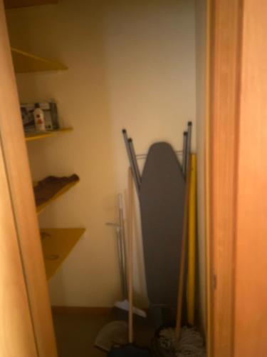 a room with a closet with a toilet in it at Apartamento T2 em Palmarejo in Prainha