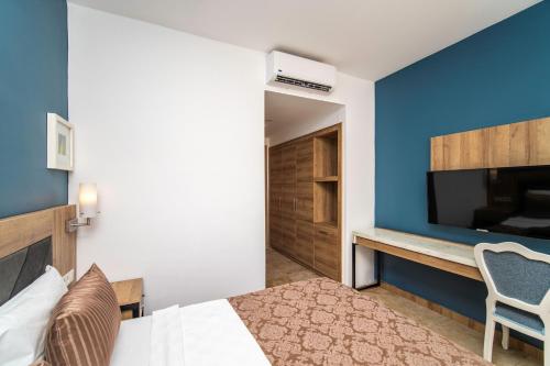 Ένα ή περισσότερα κρεβάτια σε δωμάτιο στο SL La Perla Hotel Kemer