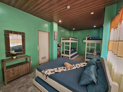 Postel nebo postele na pokoji v ubytování Airusxander Beach Resort