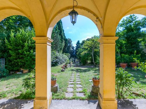 a view of a garden through an archway at Holiday Home Villa Mandri by Interhome in Castelfranco Piandisco