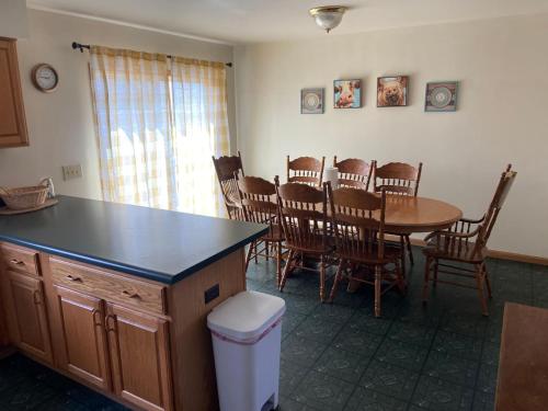 a kitchen and dining room with a table and chairs at Large Country Home in Bloomington