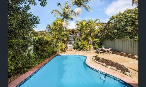 an overhead view of a swimming pool in a yard at Ground Level Apartment with Pool in Sydney