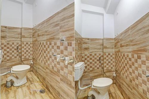 a bathroom with two toilets and wooden walls at Hotel O ONCE MORE RESTAURANT AND CAFE in Prayagraj