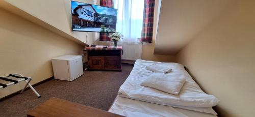 Cama o camas de una habitación en Karczma na Woli