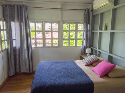 Ένα ή περισσότερα κρεβάτια σε δωμάτιο στο La Guayana Hostel