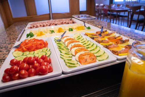 a buffet with several trays of different types of food at Landgasthof Ochsen in Neresheim