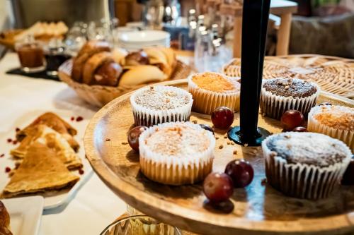 a plate of cupcakes and bread on a table at Landgasthof Ochsen in Neresheim