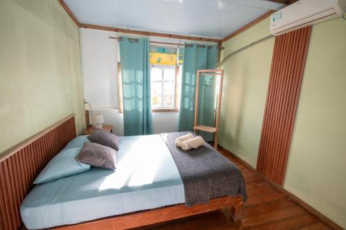 Ένα ή περισσότερα κρεβάτια σε δωμάτιο στο La Guayana Hostel