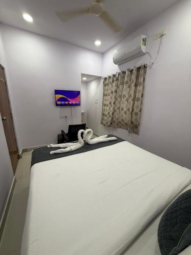 Una cama o camas en una habitación de Hotel Udaan Villa