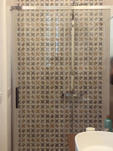 a bathroom with a shower with a toilet and a sink at Casa Graziella in Capo dʼOrlando