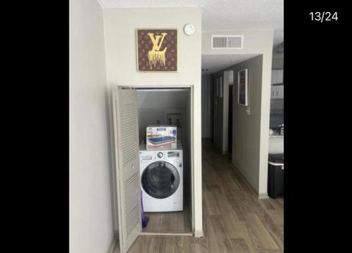a washer and dryer in a hallway of a house at Quality stay in Birmingham