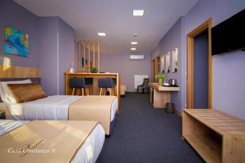 Postel nebo postele na pokoji v ubytování Casa Constanza Hotel Garni
