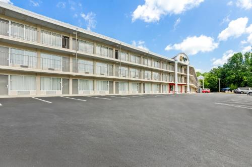 an empty parking lot in front of a building at Quality Inn Lexington in Lexington