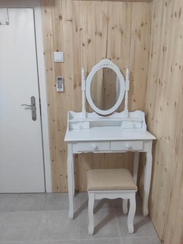 a bathroom with a white vanity with a mirror on it at Cantinho Alentejano in Estremoz