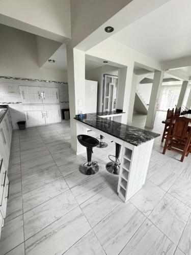 a kitchen with a marble counter top in a room at Casa en Cumbres in Ushuaia