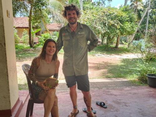 a man and a woman posing for a picture at Coco Breeze Cabanas - free Airport pick up or drop off in Katunayake