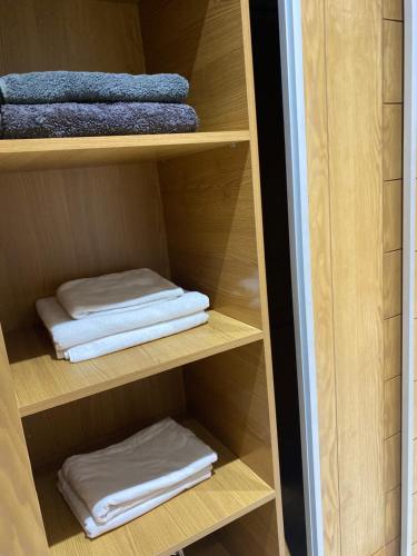 a closet with two folded towels in it at Luxury Apartment two bedroom - sea view - best spot in sousse in Sousse