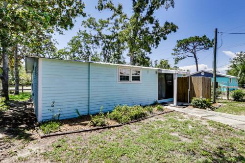 a blue tiny house in a yard at Walk to Pier and River Dtwn Steinhatchee Escape! in Steinhatchee