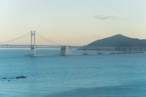 a bridge over a large body of water at All New Diamond House in Busan