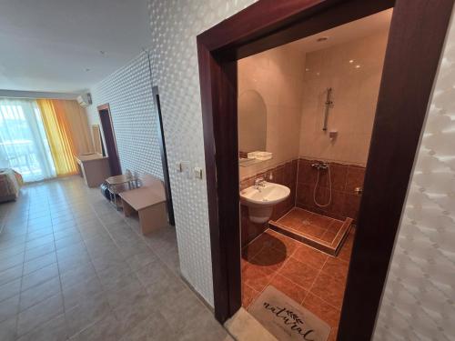 a bathroom with a toilet and a sink and a shower at Apartment Miramar Palace in Sunny Beach